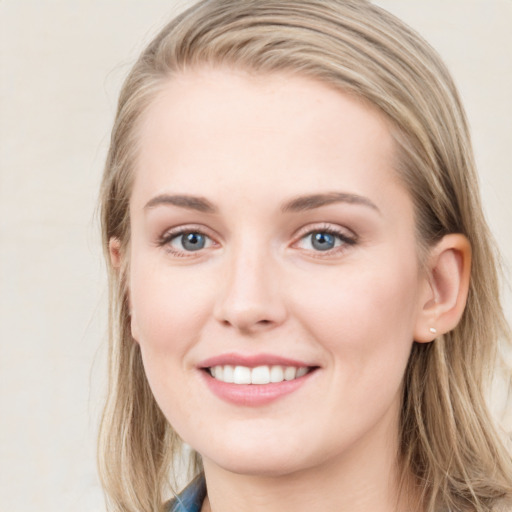 Joyful white young-adult female with medium  brown hair and blue eyes