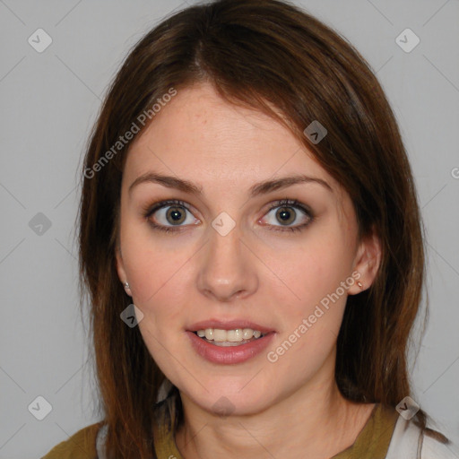 Joyful white young-adult female with medium  brown hair and blue eyes