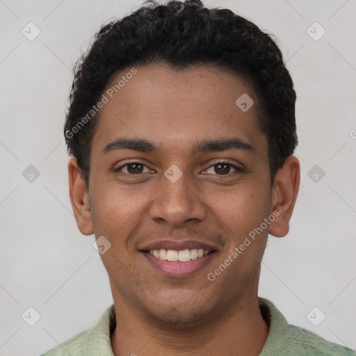 Joyful latino young-adult male with short  brown hair and brown eyes