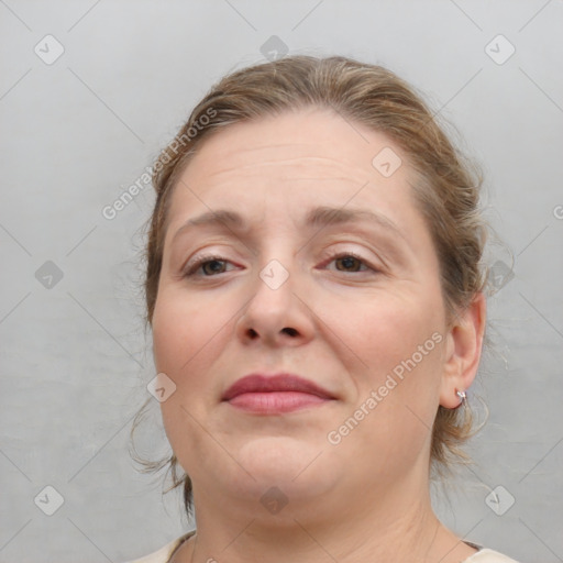 Joyful white adult female with medium  brown hair and brown eyes