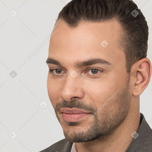 Joyful white adult male with short  brown hair and brown eyes