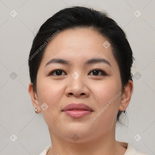 Joyful asian young-adult female with medium  brown hair and brown eyes