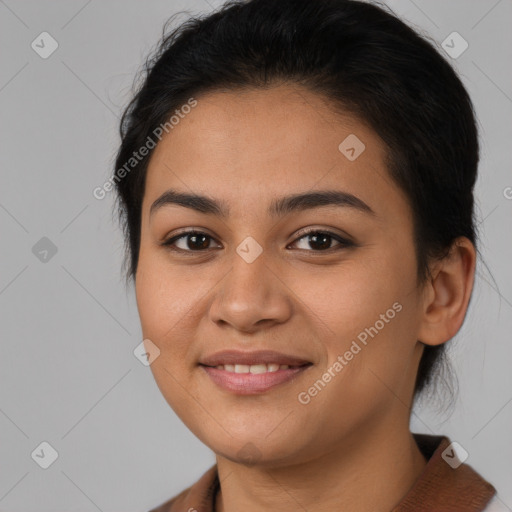 Joyful latino young-adult female with medium  brown hair and brown eyes