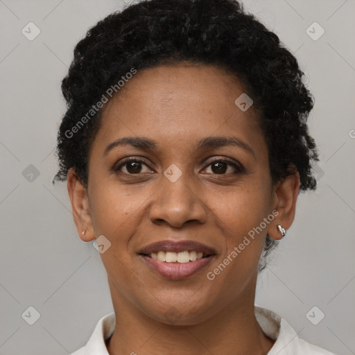 Joyful black young-adult female with short  brown hair and brown eyes