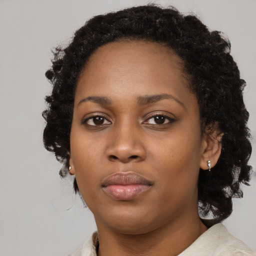 Neutral black young-adult female with medium  black hair and brown eyes