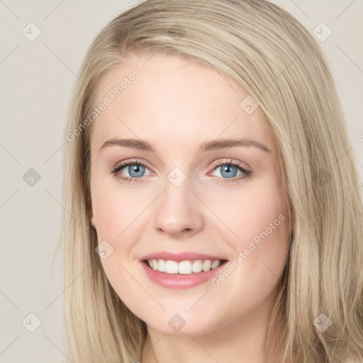 Joyful white young-adult female with long  brown hair and blue eyes