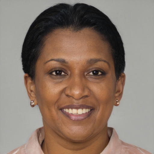Joyful latino adult female with short  brown hair and brown eyes