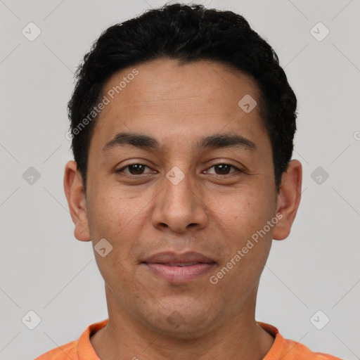 Joyful latino young-adult male with short  black hair and brown eyes