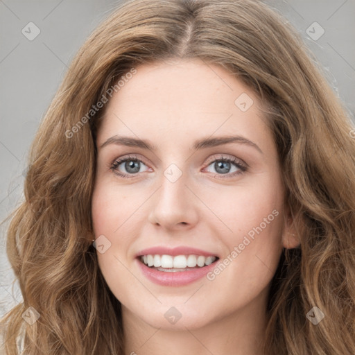 Joyful white young-adult female with long  brown hair and green eyes