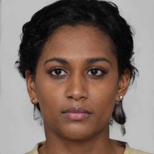 Neutral black young-adult female with short  black hair and brown eyes