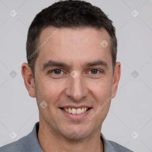 Joyful white adult male with short  brown hair and brown eyes