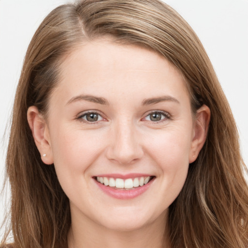 Joyful white young-adult female with long  brown hair and grey eyes