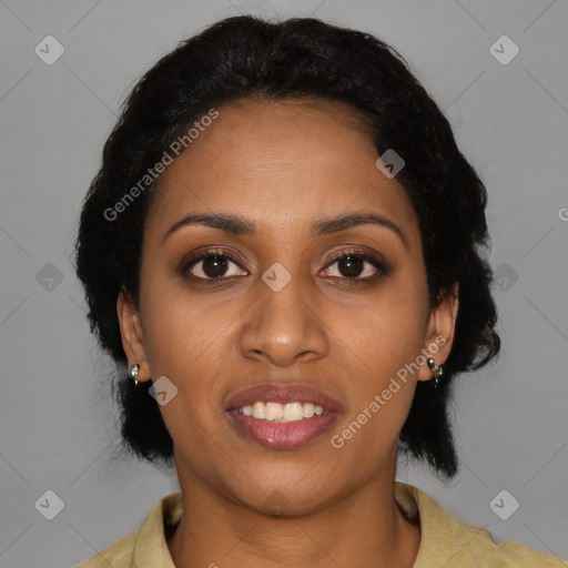 Joyful black young-adult female with short  black hair and brown eyes
