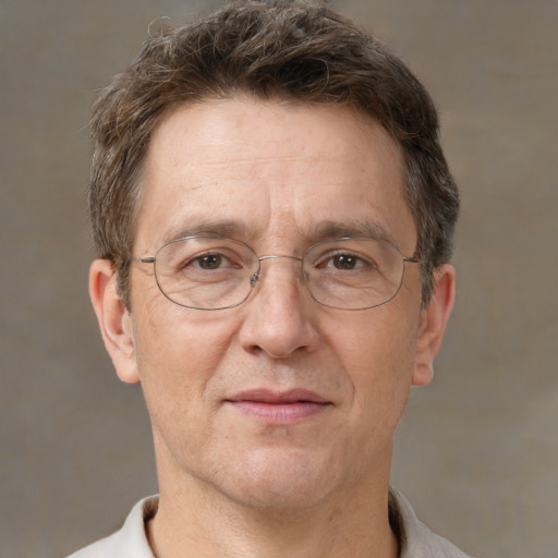 Joyful white middle-aged male with short  brown hair and brown eyes