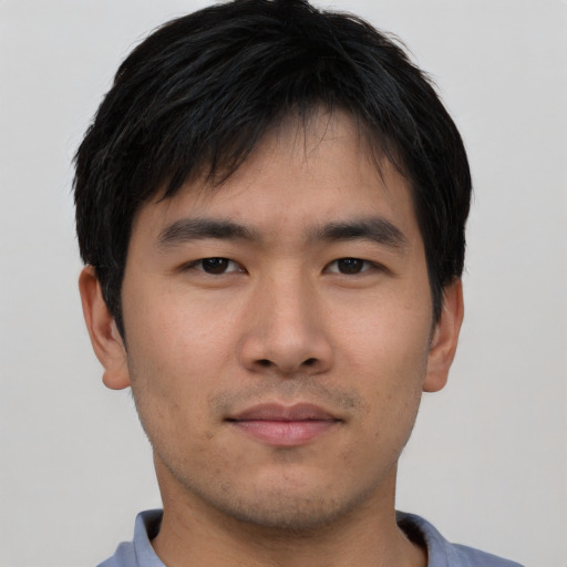 Neutral asian young-adult male with short  brown hair and brown eyes