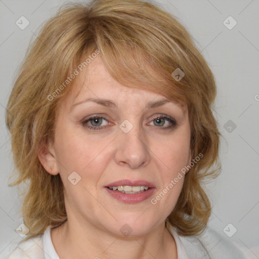 Joyful white adult female with medium  brown hair and blue eyes