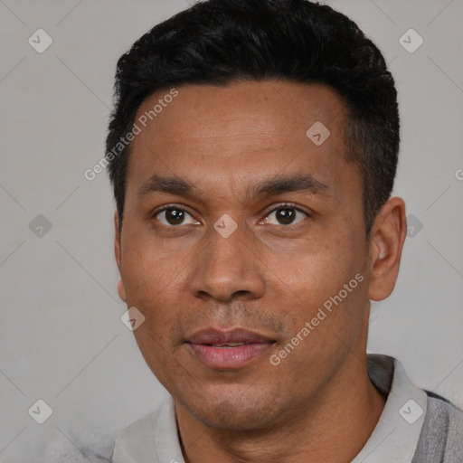 Joyful black adult male with short  black hair and brown eyes