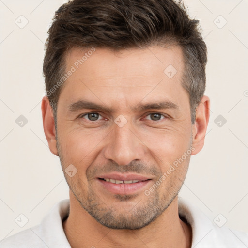 Joyful white adult male with short  brown hair and brown eyes