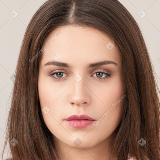 Neutral white young-adult female with long  brown hair and brown eyes