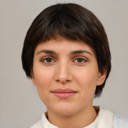 Joyful white young-adult female with medium  brown hair and brown eyes