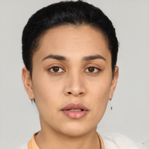 Neutral latino young-adult female with short  brown hair and brown eyes