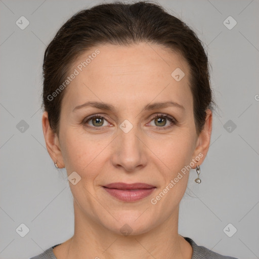 Joyful white adult female with short  brown hair and grey eyes