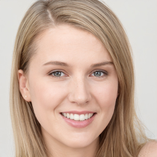 Joyful white young-adult female with long  brown hair and grey eyes