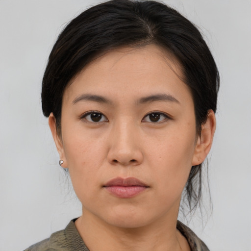 Neutral asian young-adult female with medium  brown hair and brown eyes