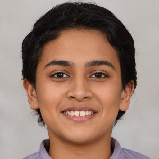 Joyful latino young-adult female with short  brown hair and brown eyes