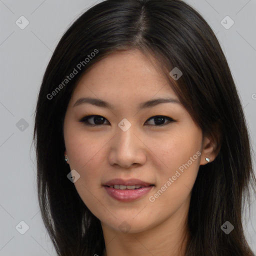 Joyful asian young-adult female with long  brown hair and brown eyes