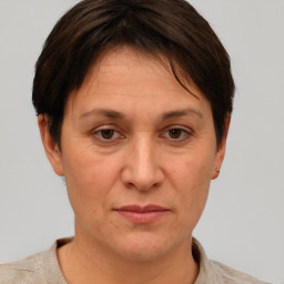 Joyful white adult female with short  brown hair and brown eyes