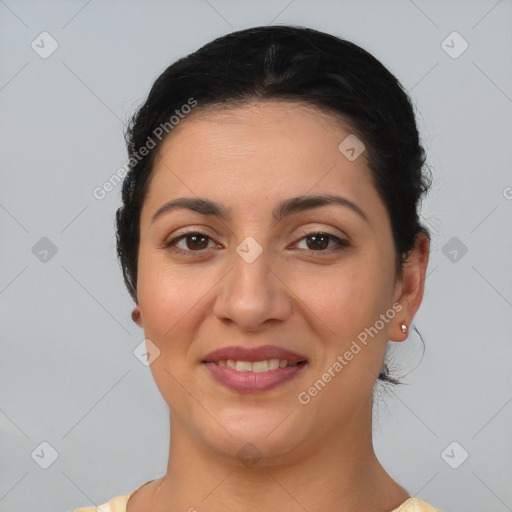 Joyful latino young-adult female with short  brown hair and brown eyes