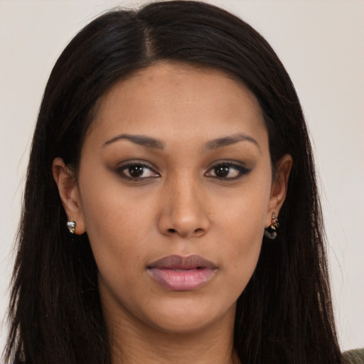Neutral black young-adult female with long  brown hair and brown eyes