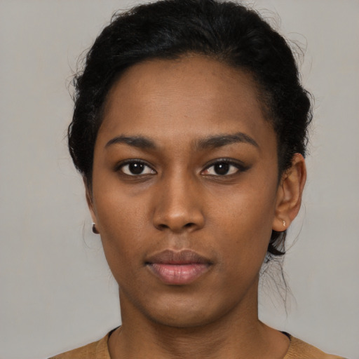 Neutral black young-adult female with short  black hair and brown eyes