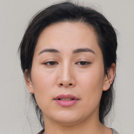 Neutral asian young-adult female with medium  brown hair and brown eyes