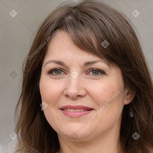 Joyful white adult female with long  brown hair and brown eyes