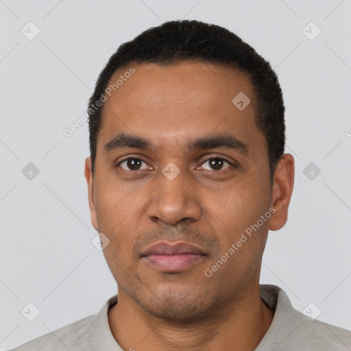 Neutral latino young-adult male with short  black hair and brown eyes