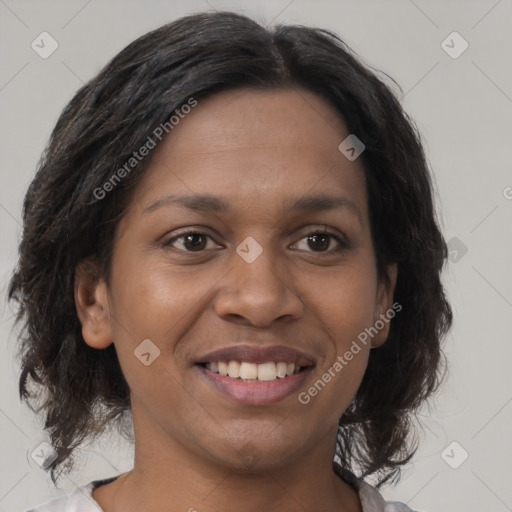 Joyful black young-adult female with medium  brown hair and brown eyes