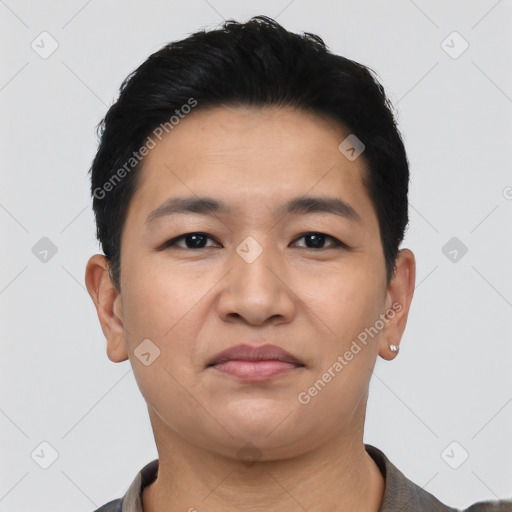 Joyful asian young-adult male with short  black hair and brown eyes