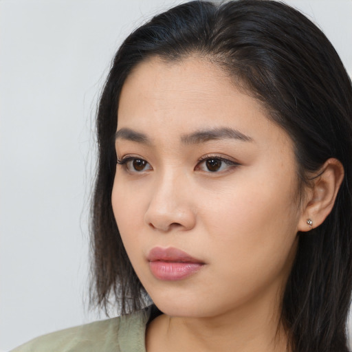 Neutral asian young-adult female with long  brown hair and brown eyes