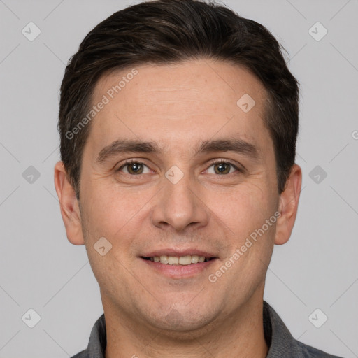 Joyful white adult male with short  brown hair and brown eyes