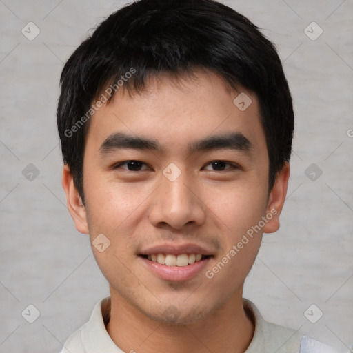 Joyful asian young-adult male with short  black hair and brown eyes