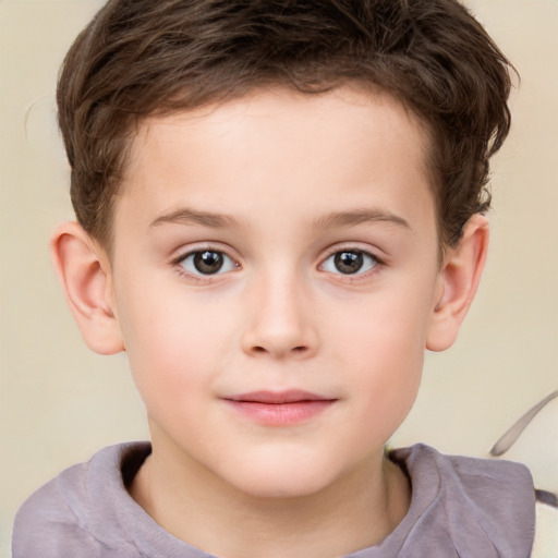 Joyful white child male with short  brown hair and brown eyes