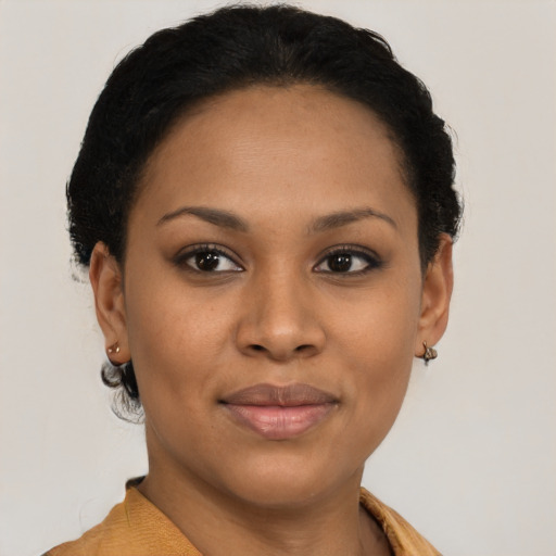Joyful latino young-adult female with short  brown hair and brown eyes