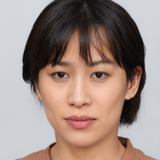 Neutral white young-adult female with medium  brown hair and brown eyes