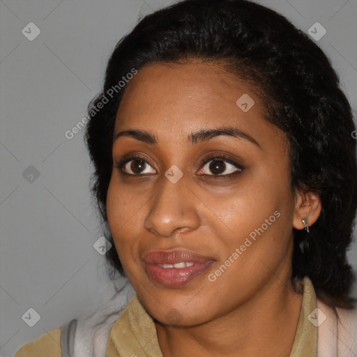 Joyful black young-adult female with medium  black hair and brown eyes