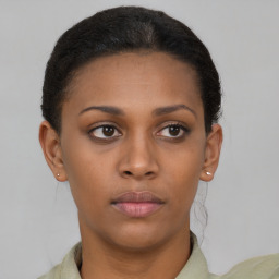 Neutral black young-adult female with short  brown hair and brown eyes