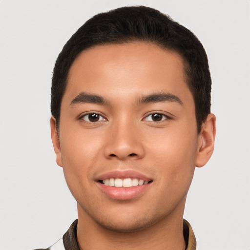 Joyful asian young-adult male with short  brown hair and brown eyes