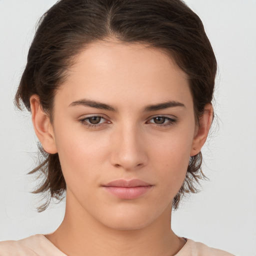 Neutral white young-adult female with medium  brown hair and brown eyes