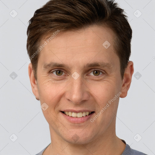 Joyful white adult male with short  brown hair and brown eyes